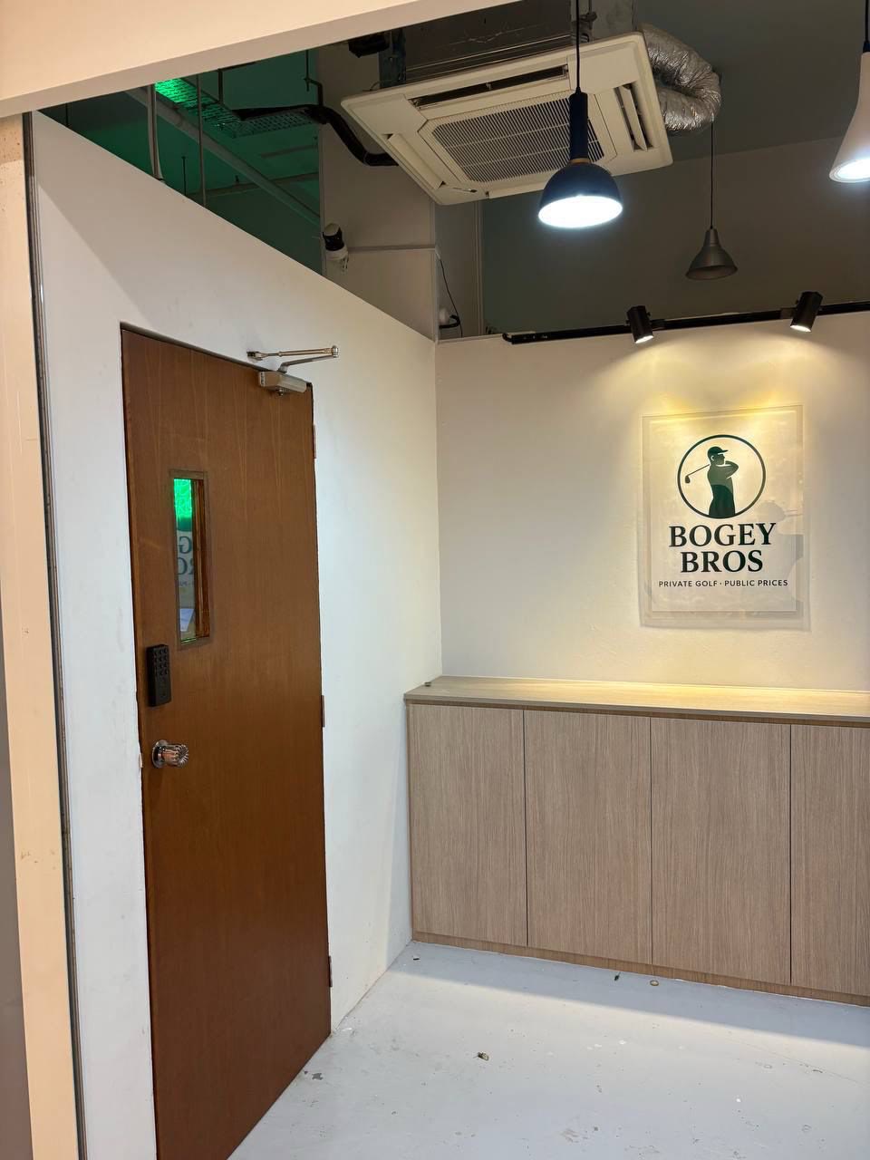 Entrance area of the Bogey Bros golf simulator unit at NEWest near Clementi